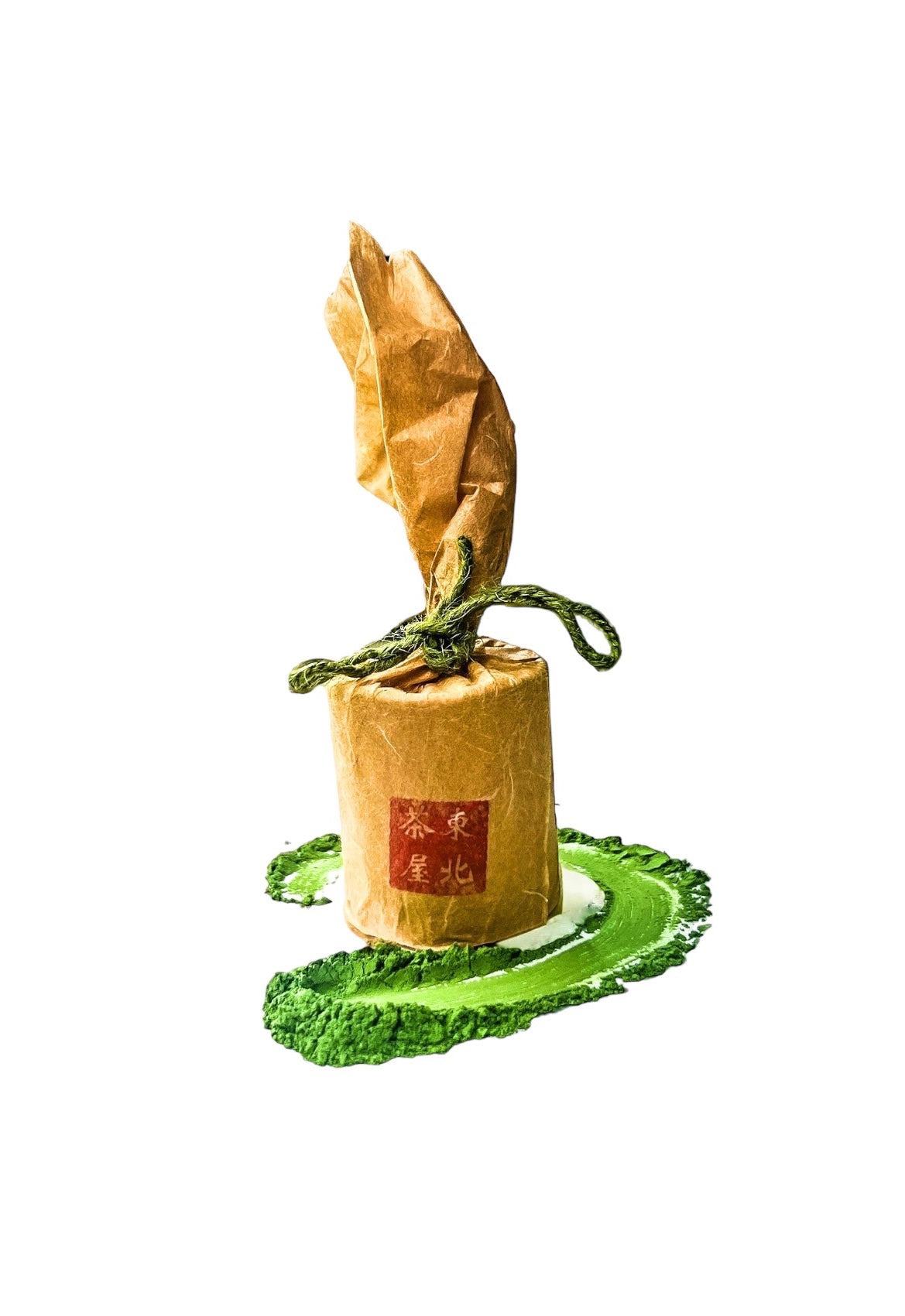 A tin of Asahi Ceremonial Matcha Surrounded by a Matcha enso.