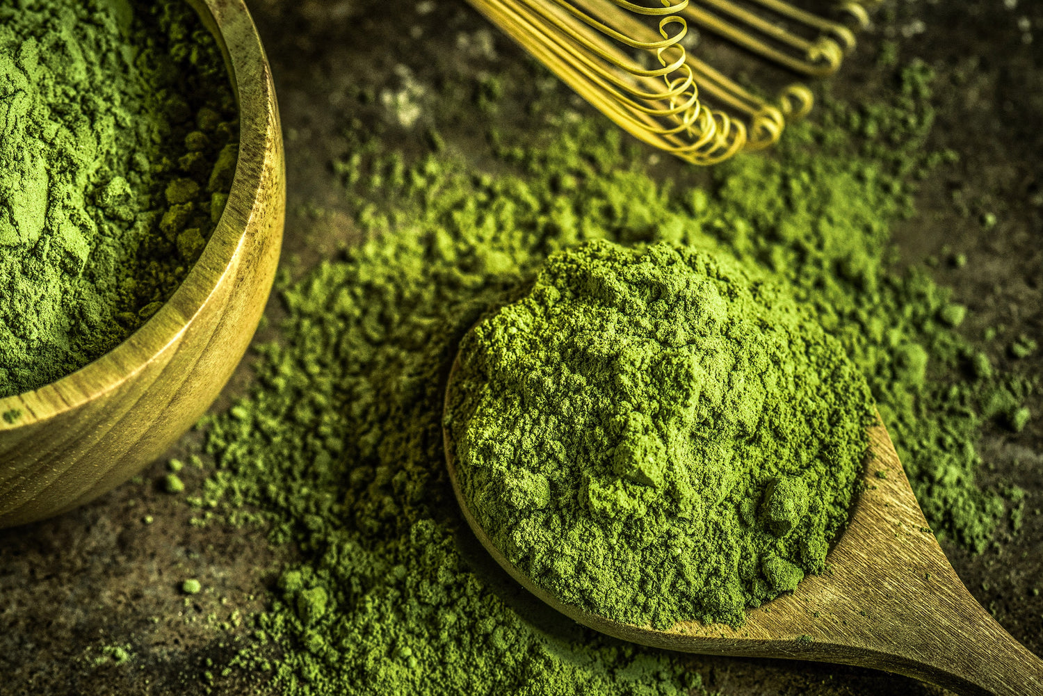 Close up of ceremonial matcha on a wood table.