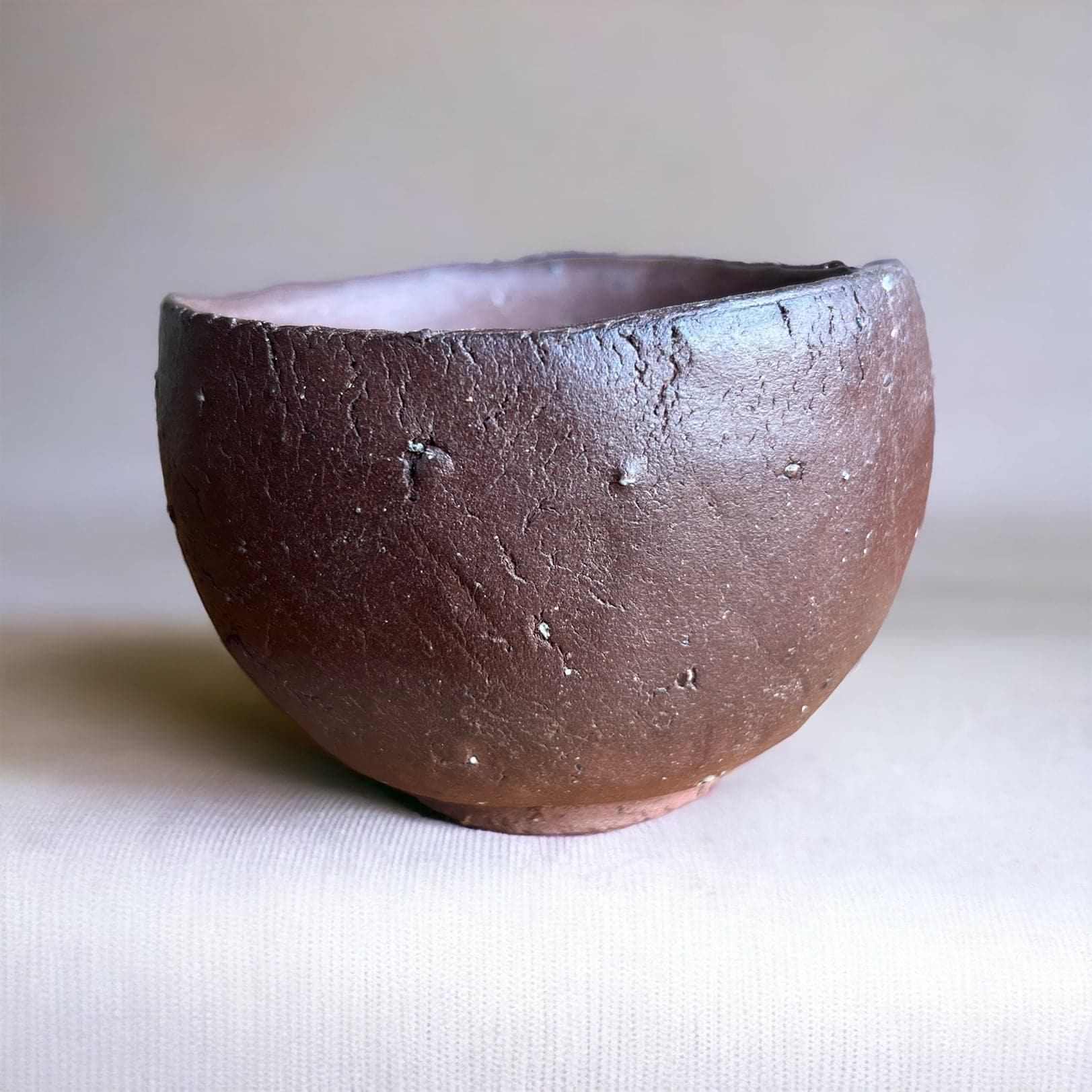 Side shot of the Hand Made Brick Clay matcha bowl.