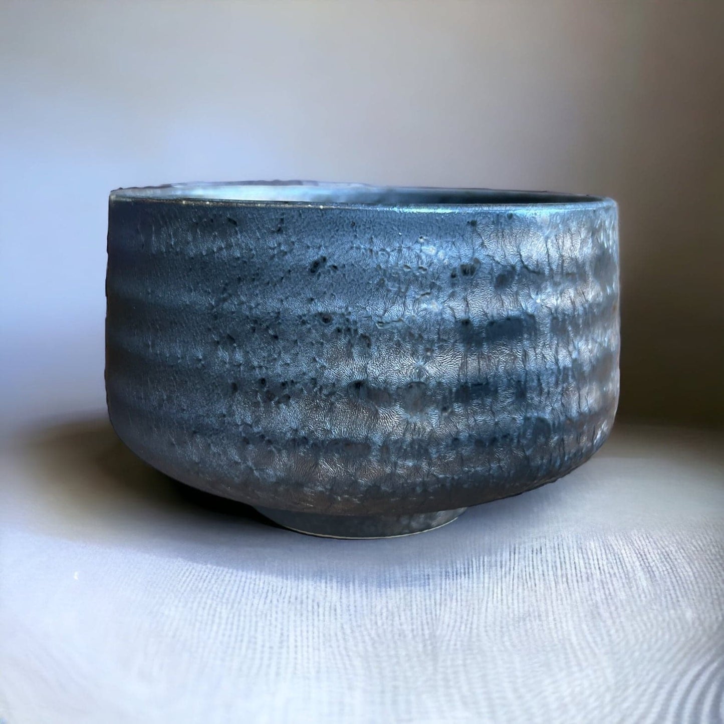 Side shot of the brushed metal matcha bowl.
