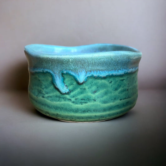 Side shot of the sky blue and green matcha bowl.