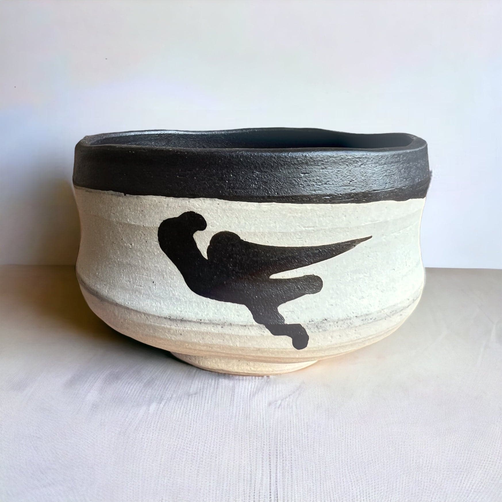 The third side of the hand made Ink Spot Matcha Bowl.